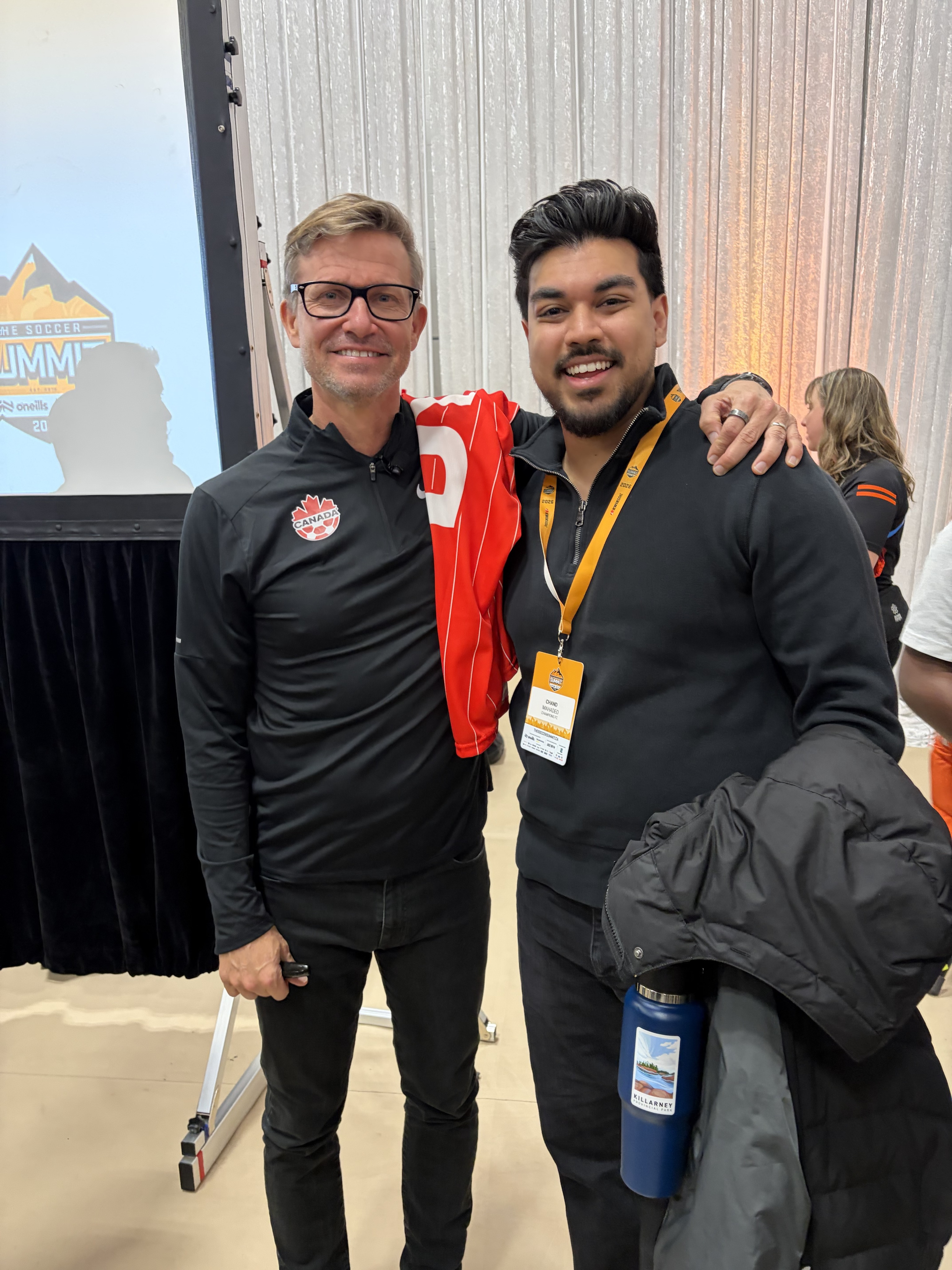 Champions FC representative with Canada Soccer official at Soccer Summit
